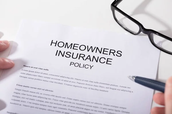 depositphotos_181185416-stock-photo-close-homeowners-insurance-policy-form
